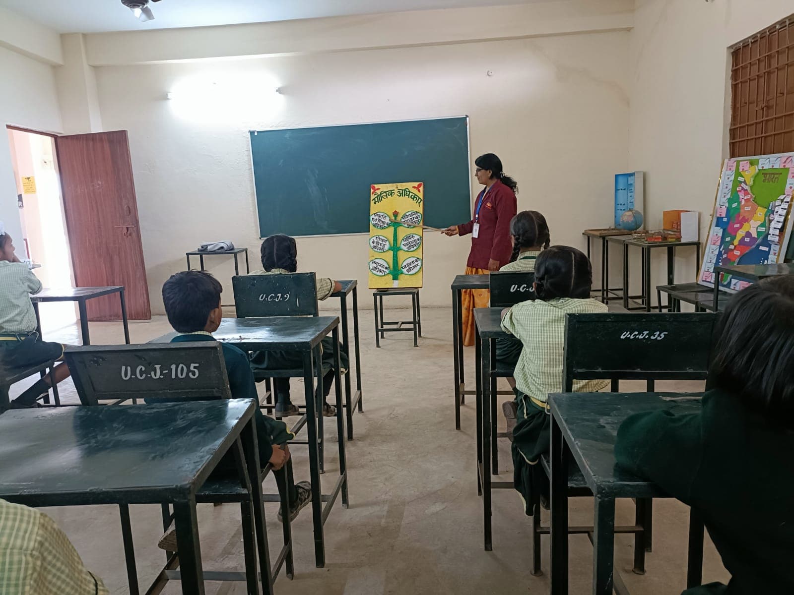 A teacher taking a class at Uday Public School