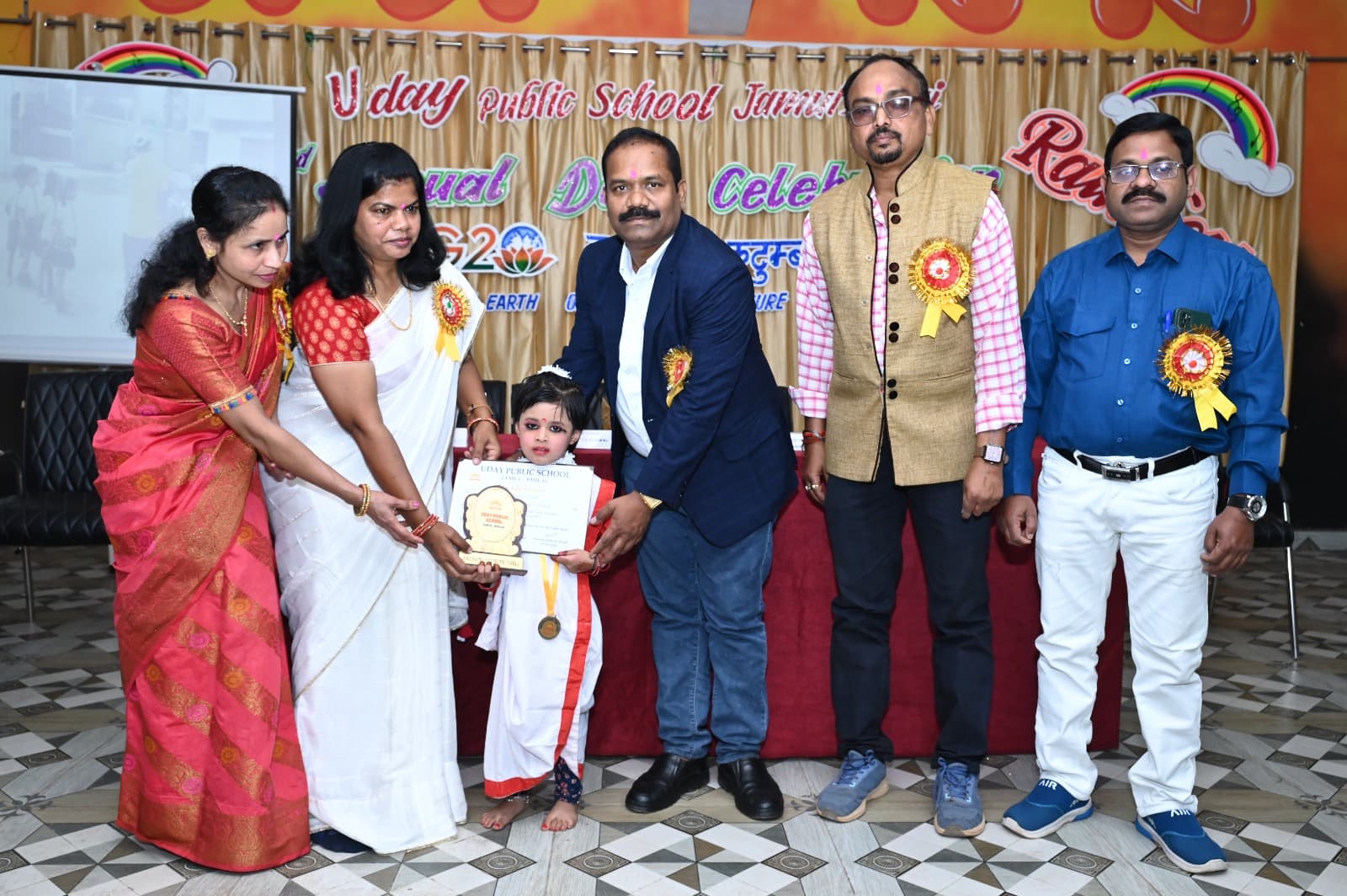 A young student being felicitated at Uday Public School