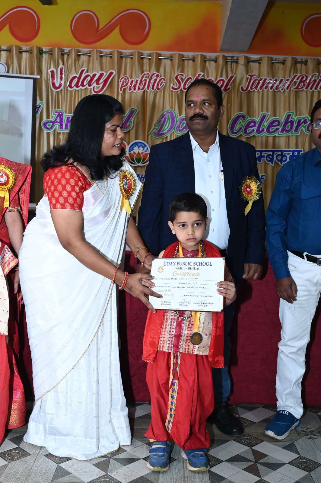 A student being felicitated at Uday Public School Annual Day